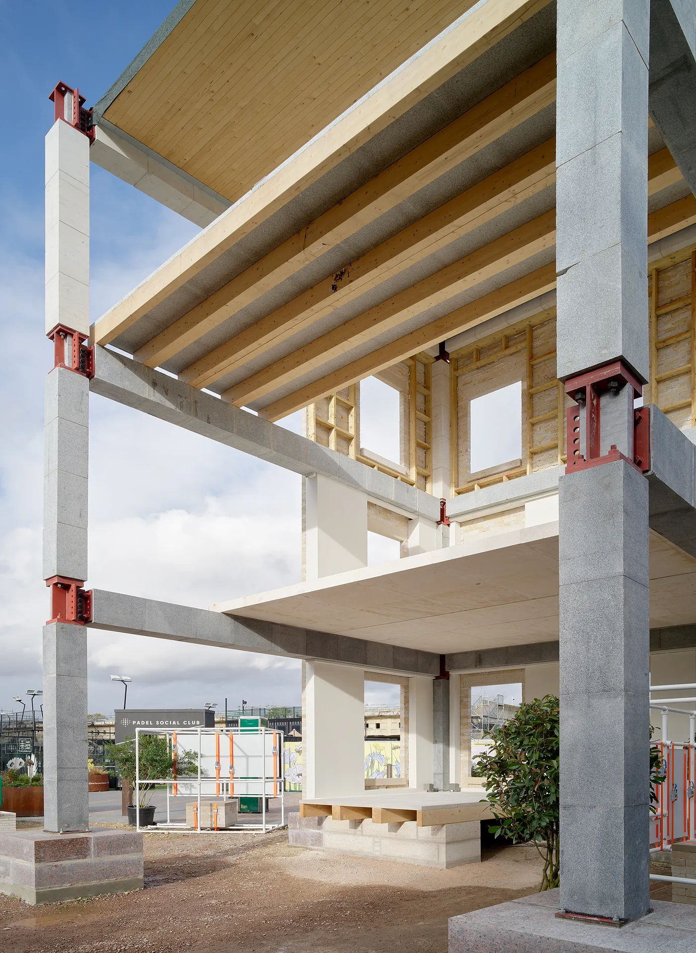Interior view of Stone Demonstrator showing pre-tensioned stone columns and timber roof structure